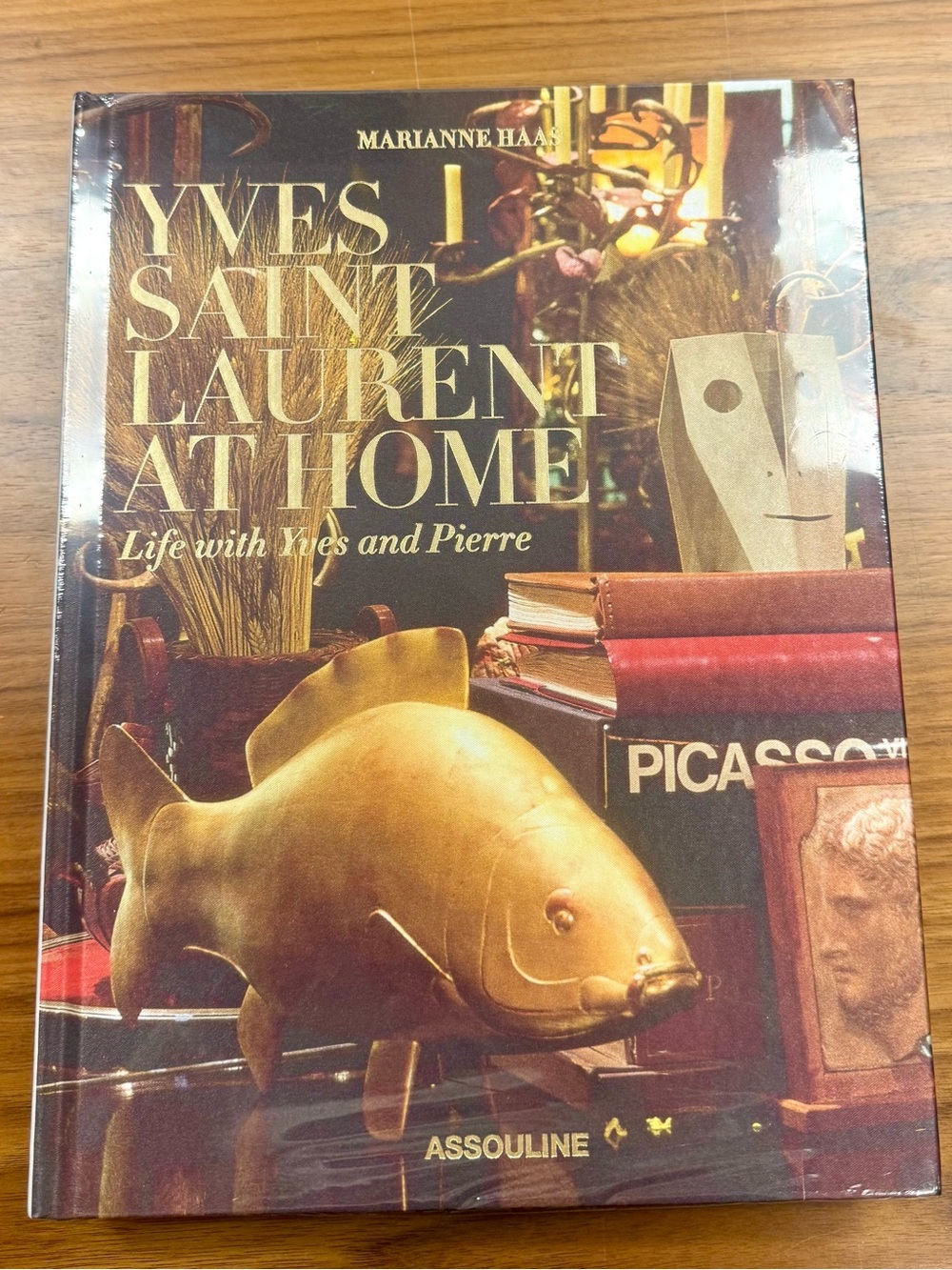 Assouline Yves Saint Laurent At Home Coffee Table Book - Gold & Brown Cover